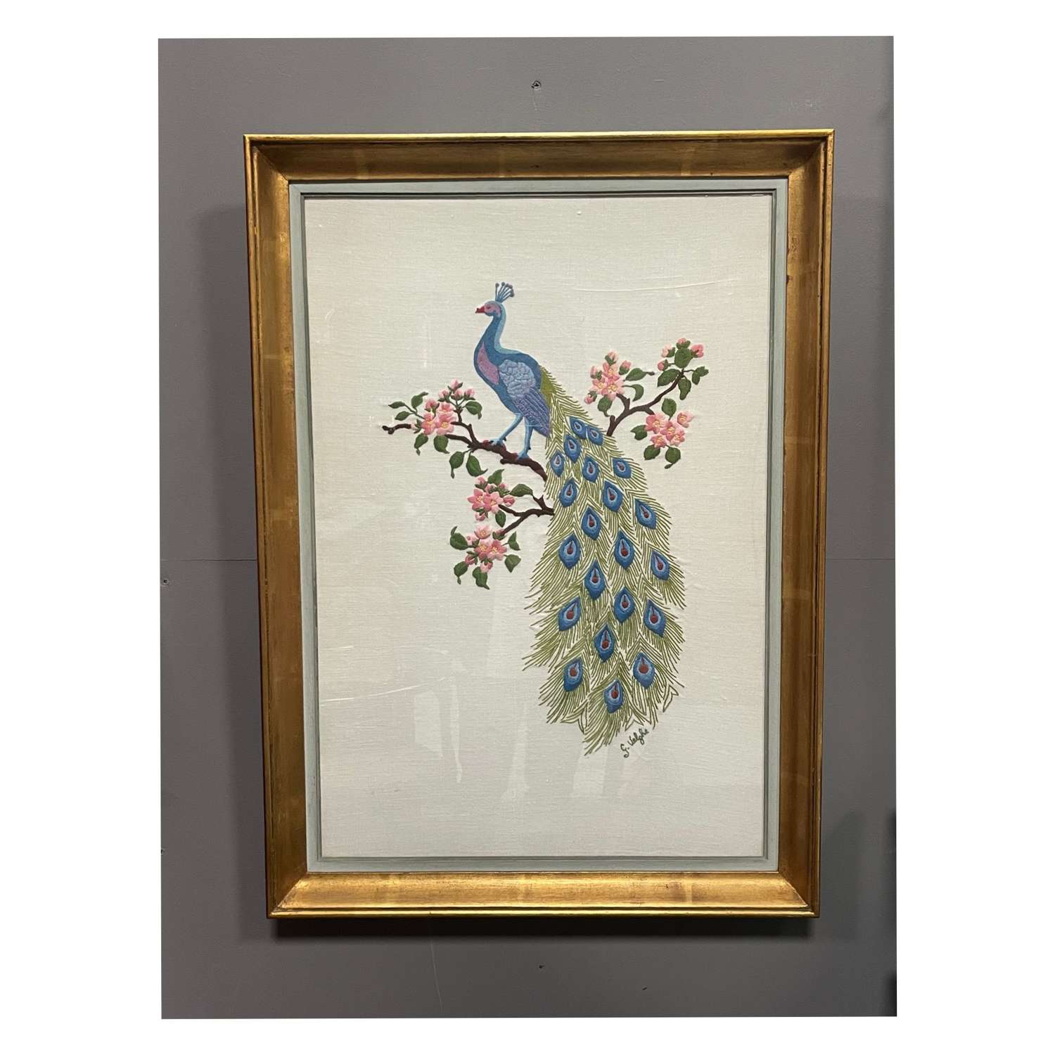 Framed French embroidery of a peacock