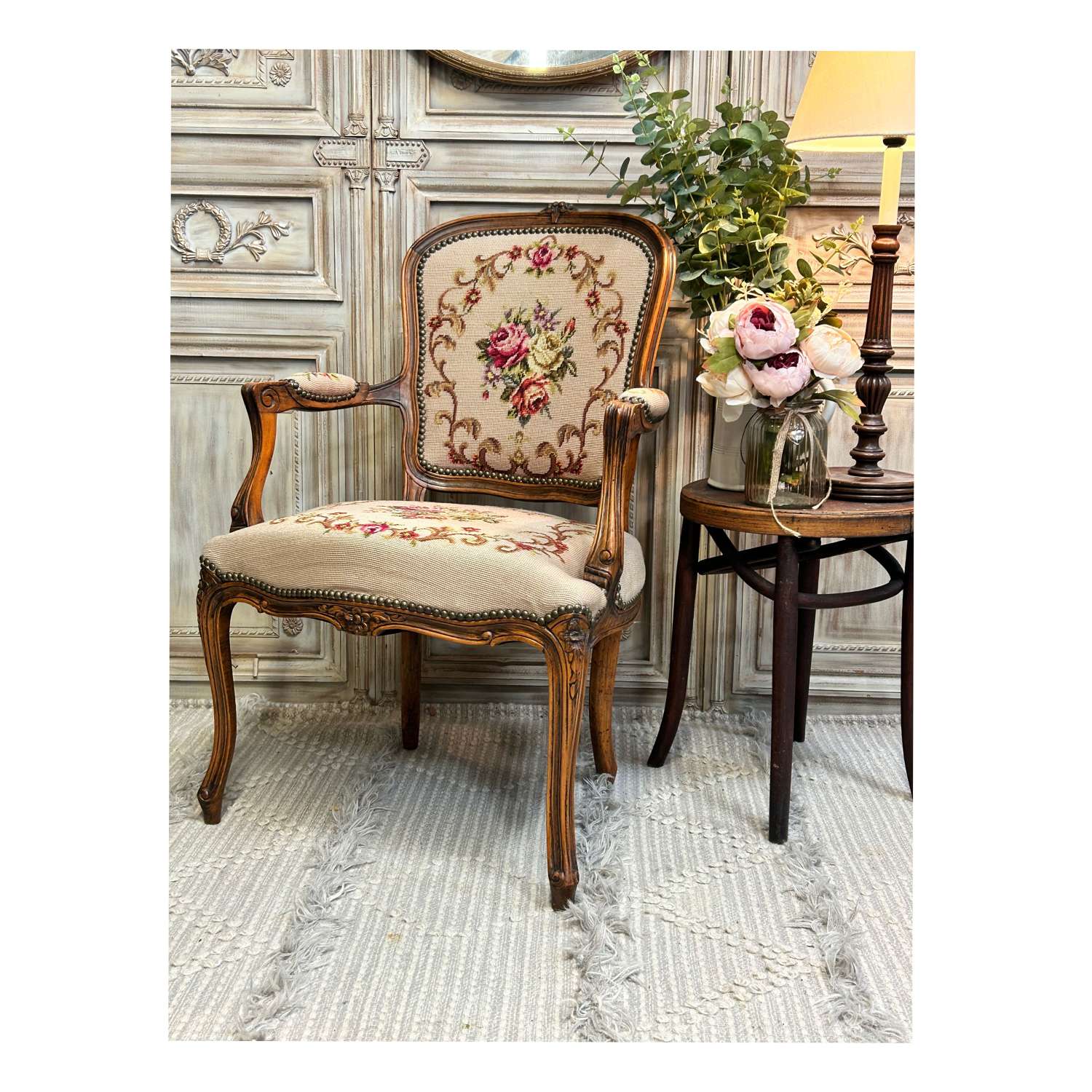 Vintage French tapestry chair with carved frame.